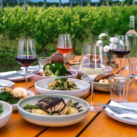 A table laid with beautiful food and wine
